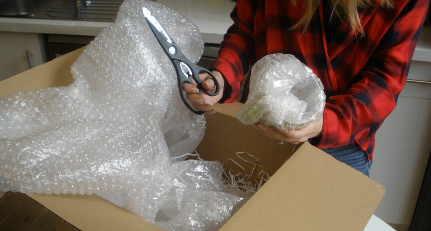 A woman unboxing her parcel