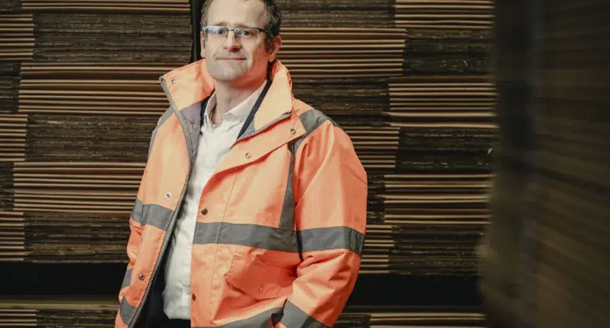 Image shows David Patton, Macfarlane Packaging's head of sustainability, wearing an orange high visibility jacket